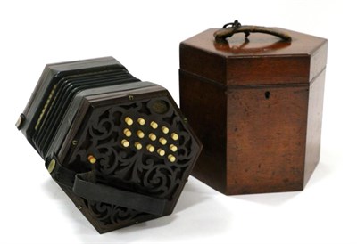 Lot 178 - A George Jones Thirty Button Concertina, of hexagonal form with fret carved ends and leather...