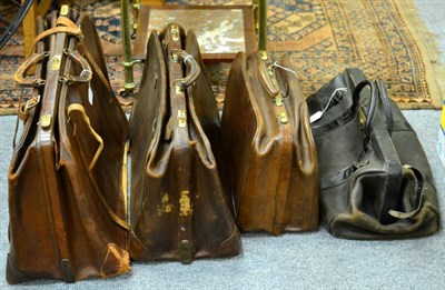Lot 182 - A Vintage Black Leather Gladstone Bag; A Brown Leather Gladstone Bag; and Two Vintage Brown Leather