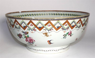 Lot 8 - A Chinese Porcelain Punch Bowl, Qianlong, painted in famille rose enamels with flowersprays...