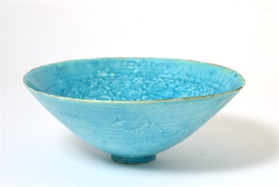 Lot 9 - A Persian Turquoise Glazed Bowl, possibly Kashan, 13th/14th century, with carved foliate...