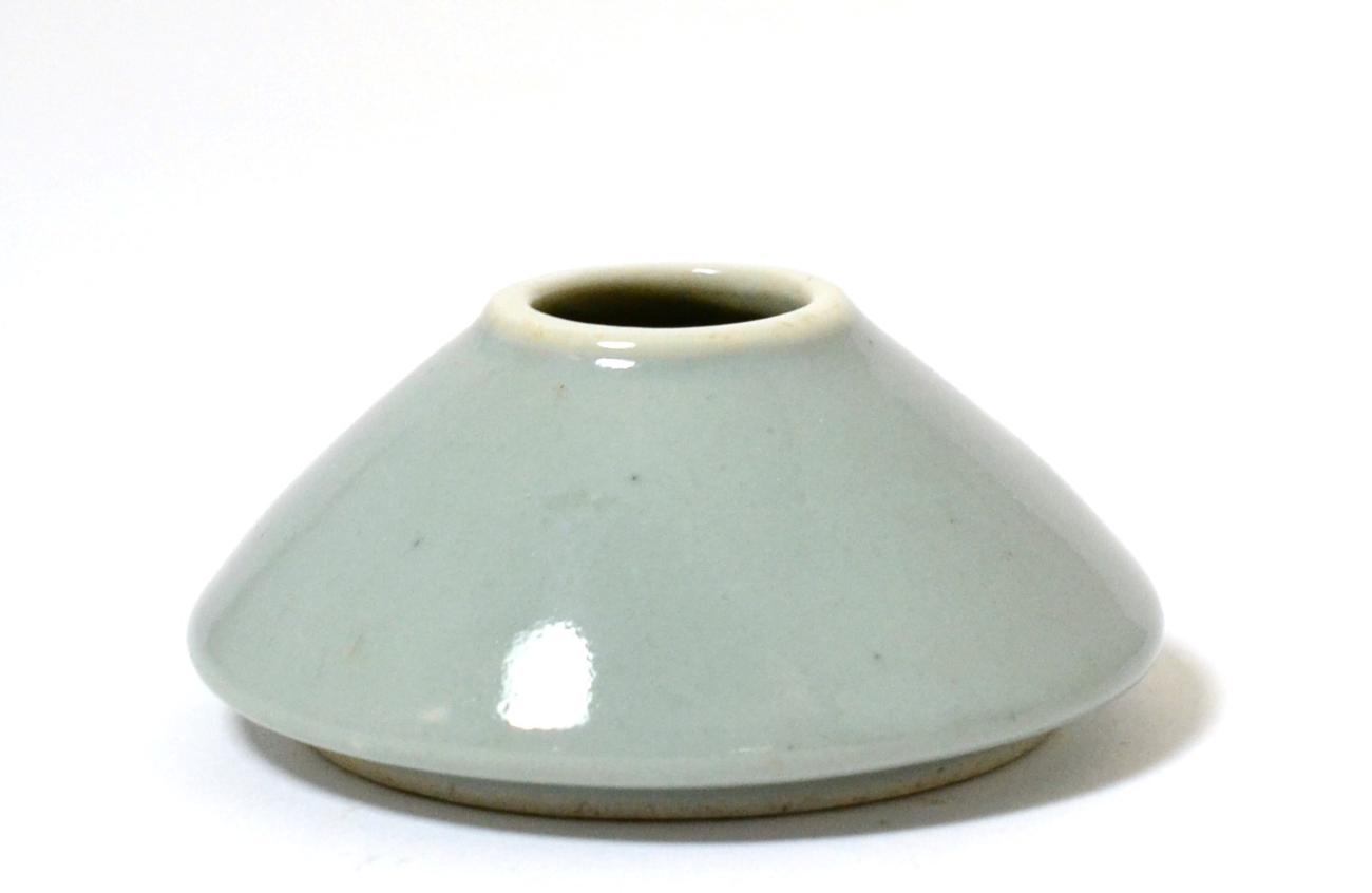 Lot 12 - A Chinese Celadon Glazed Conical Brush Pot, bears six character Kangxi reign marks, 8cm diameter