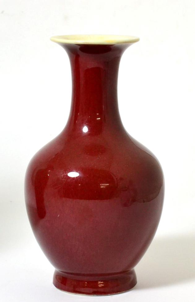 Lot 15 - A Chinese Sang de Boeuf Glazed Baluster Vase, Qing Dynasty, with trumpet neck, 20.5cm high