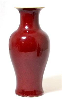Lot 16 - A Chinese Sang de Boeuf Glazed Baluster Vase, Qing Dynasty, with flared neck, 24.5cm high