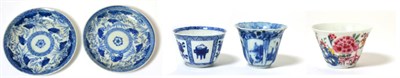 Lot 26 - A Chinese Porcelain Tea Bowl, Kangxi period, painted in underglaze blue with figures in panels;...