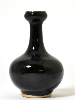 Lot 31 - A Chinese Black Glazed Bottle Vase, Qing Dynasty, with garlic neck, 13.5cm high