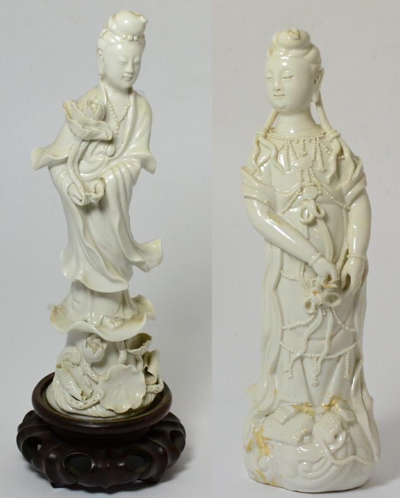 Lot 34 - A Chinese Blanc de Chine Figure of Guanyin, Qing Dynasty, standing wearing flowing robes on a...
