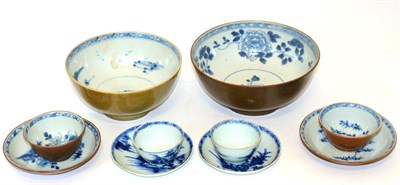 Lot 72 - A Pair of Nanking Cargo Tea Bowls and Saucers, painted in underglaze blue with river...