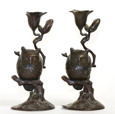 Lot 116 - A Pair of Japanese Bronze Figural Candlesticks, Meiji period, modelled as owls sitting in branches