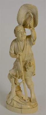 Lot 119 - A Japanese Ivory Okimono, Meiji period, as a farmer holding his hat above his head, signed,...
