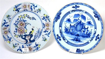 Lot 132 - An English Delft Circular Dish, circa 1750, painted in colours with a peacock perched amongst...