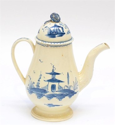 Lot 135 - A Creamware Coffee Pot and Cover, circa 1780, of baluster form, painted in underglaze blue with...
