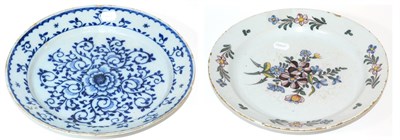 Lot 137 - An English Delft Charger, mid 18th century, painted in colours with a central flowerspray and...