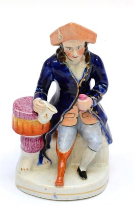 Lot 174 - A Staffordshire Pottery Figure of a Chelsea Pensioner, circa 1860, seated with wooden leg holding a
