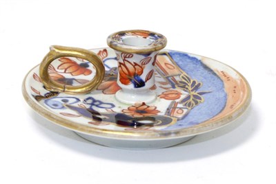 Lot 182 - A Masons Ironstone Taperstick, circa 1815, of circular form with ring handle, painted with an Imari