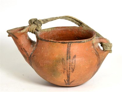 Lot 191 - A Pre-Columbian Type Terracotta Pouring Vessel, painted with stylised foliage and with webbing...