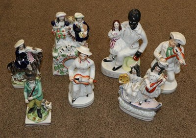 Lot 200 - A Staffordshire Pottery Figure of UNCLE TOM & EVA, 24cm high; A Similar Clock Group as Highlanders