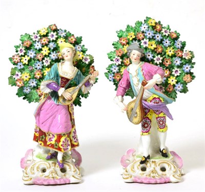 Lot 203 - A Pair of Chelsea Style Porcelain Figures, circa 1900, as 18th century musicians standing...