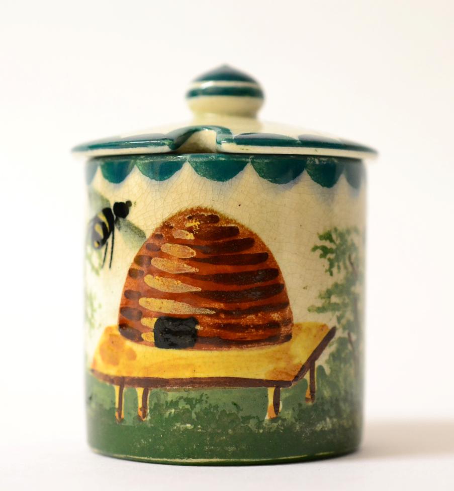 Lot 210 - A Wemyss Pottery Small Honey Pot, early 20th century, of cylindrical form, painted with bees...