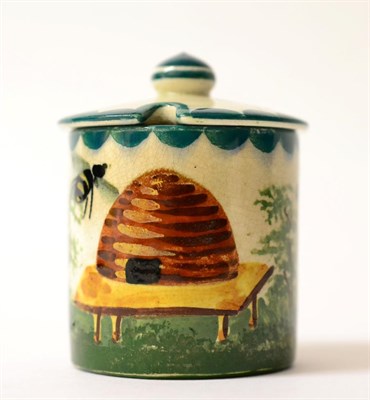 Lot 210 - A Wemyss Pottery Small Honey Pot, early 20th century, of cylindrical form, painted with bees...