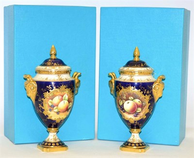 Lot 220 - A Pair of Coalport Porcelain Urn Shaped Vases and Covers, 20th century, decorated with still...