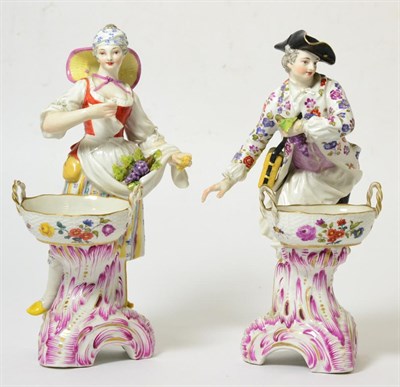 Lot 223 - A Pair of Berlin Porcelain Figural Salts, late 19th century, modelled as a vintner and his...