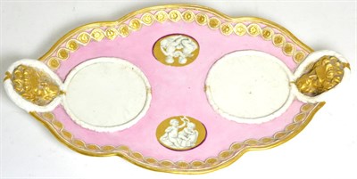 Lot 228 - A Hoechst Porcelain Desk Stand, circa 1780, of shaped oval form with mask handles, painted en...