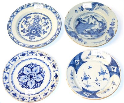 Lot 234 - A Delft Pancake Plate, 18th century, painted in blue with a stylised flowerhead within a...