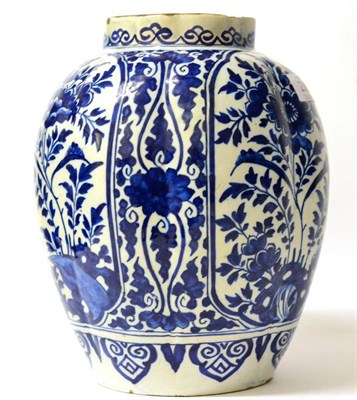 Lot 236 - A Delft Fluted Jar, early 18th century, painted in blue with panels of stylised foliage on a...