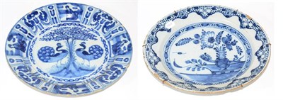 Lot 237 - A Delft Charger, early 18th century, painted in Kraak style with peacocks in a garden within a...