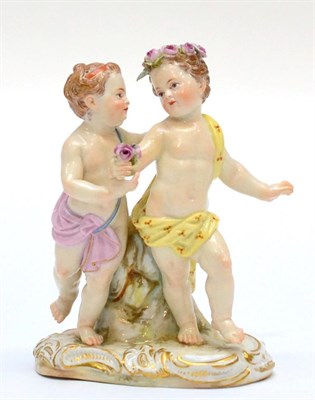 Lot 242 - A Meissen Porcelain Figure Group, late 19th century, as a pair of children dancing, on a scroll...