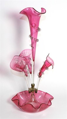 Lot 285 - A Cranberry Glass Epergne, the central trumpet vase flanked by three further vases, on a fluted...