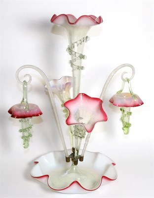 Lot 287 - A Pink Vaseline Glass Epergne, with frilled rims, the central trumpet vase flanked by two...