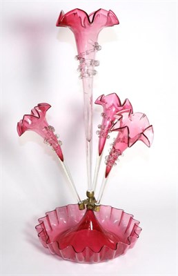 Lot 288 - A Cranberry Glass Epergne, with frilled rims, the central trumpet vase flanked by three further...