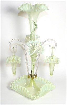 Lot 289 - A Vaseline Glass Epergne, with frilled rims, the central trumpet vase flanked by two further...