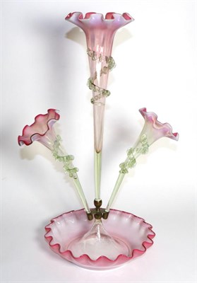 Lot 291 - A Pink Vaseline Glass Epergne, with frilled rims, the central trumpet vase flanked by two...