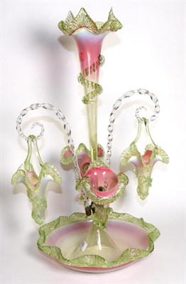 Lot 292 - A Pink and Green Vaseline Glass Epergne, with fluted frilled rims, the central trumpet vase flanked