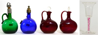 Lot 301 - A Harlequin Group of Four Glass Spirit Flasks, in various colours with loop handles and...