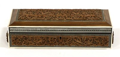 Lot 392 - An Indian Sandalwood Box and Hinged Cover, 19th century, carved with panels of animals amongst...