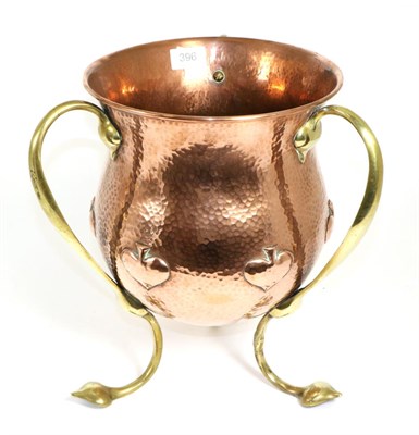 Lot 396 - An Art Nouveau Copper and Brass Jardinière, of plannished baluster form repoussé with...