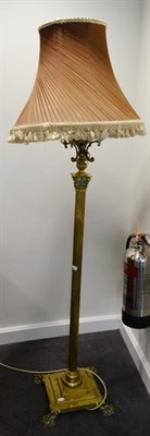 Lot 402 - A Brass Standard Lamp, late 19th century, modelled as a corinthian column, the reservoir on...