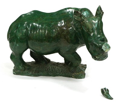 Lot 403 - A Malachite Model of a Rhinoceros, naturalistically modelled standing on a mound base, 48cm long