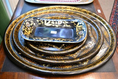 Lot 405 - A Graduated Set of Three Victorian Papier Mâché Oval Trays, painted with flowersprays within gilt