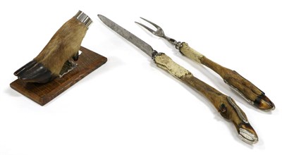 Lot 424 - A Hunting Trophy, circa 1838, as a silver plate mounted Red Deer hoof, on an oak plinth, 18cm long