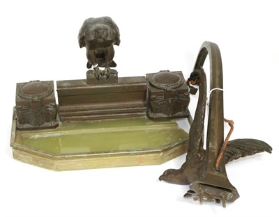 Lot 425 - A Bronze Mounted Onyx Desk Stand, 1930s, surmounted by an eagle flanked by two inkpots, 34cm...