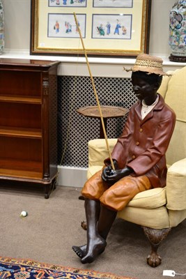 Lot 429 - A Painted Composition Figure of an African Youth, wearing a red jacket and orange breeches,...