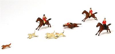 Lot 458 - A Die Cast Miniature Fox Hunting Group, comprising a fox, two pairs of hounds and four mounted...