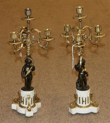 Lot 460 - A Pair of French Gilt and Patinated Bronze Four-Light Candelabra, in Louis XVI style, modelled...