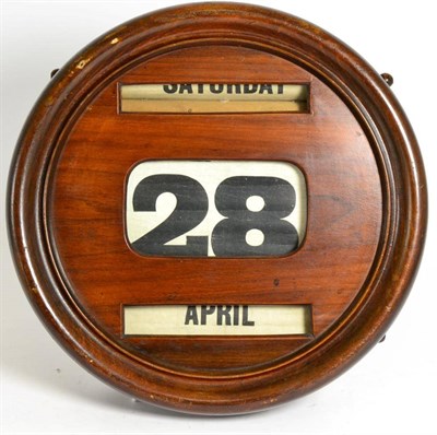 Lot 467 - A Mahogany Cased Perpetual Wall Calendar, early 20th century, with day, date and month aperture...