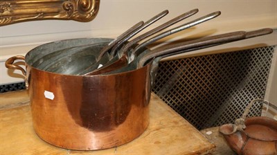 Lot 482 - A Set of Six Copper Sauce Pans, 19th century, with iron handles, 78cm long