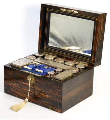 Lot 483 - A Victorian Coromandel Travelling Dressing Case, enclosing various glass bottles and boxes with...